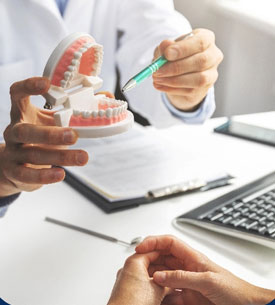 Eagle Dental Texas
a doctor showing teeth